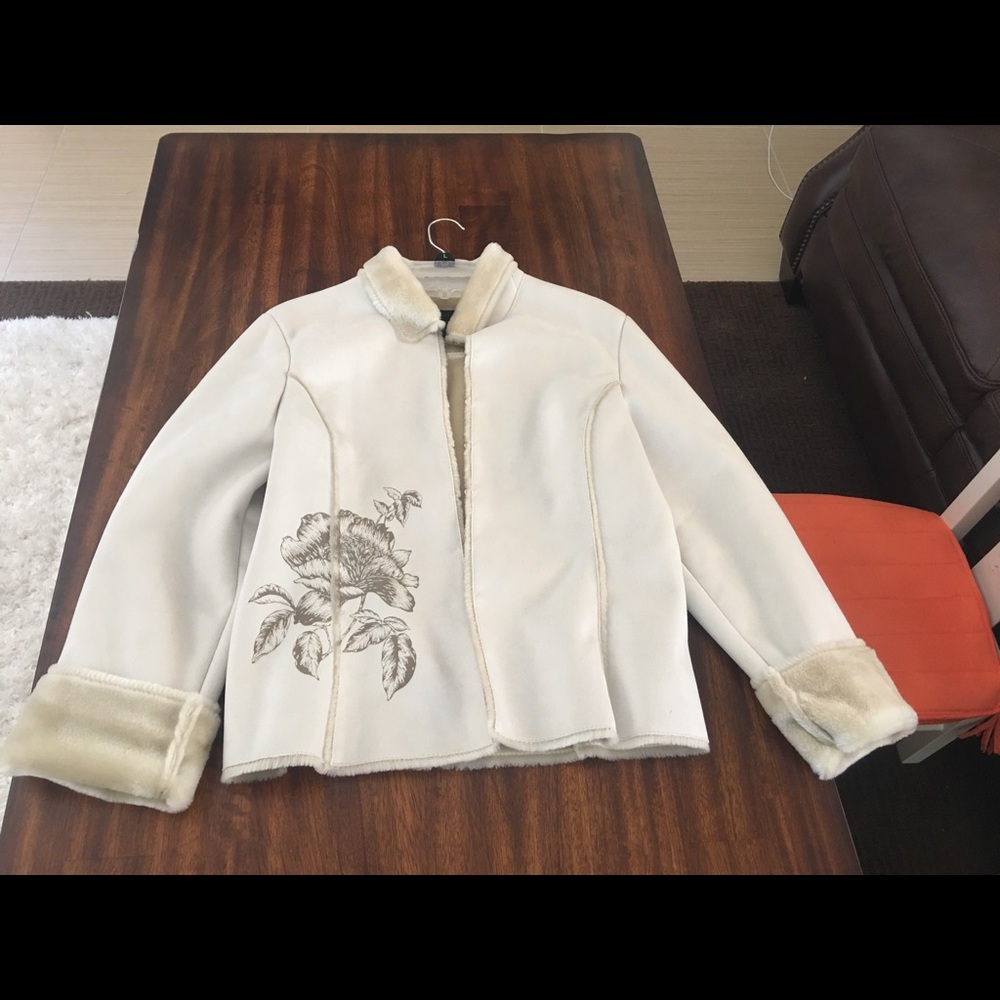 Polyester and acrylic. DRY CLEAN ONLY